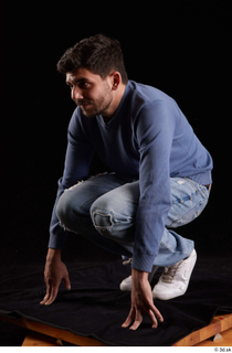 Hamza  1 blue jeans blue sweatshirt dressed kneeling white…